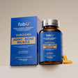 Blue supplement bottle and packaging labeled 'fabü' on a beige background