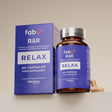 Supplement bottle and packaging labeled 'fabÜl R&R Relax' on a beige background