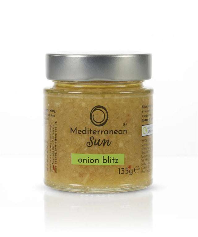 Jar of Mediterranean Sun "Onion Blitz" with a silver lid. The label is clear, showing tan onion paste inside. Weight: 135g. Simple and fresh design.