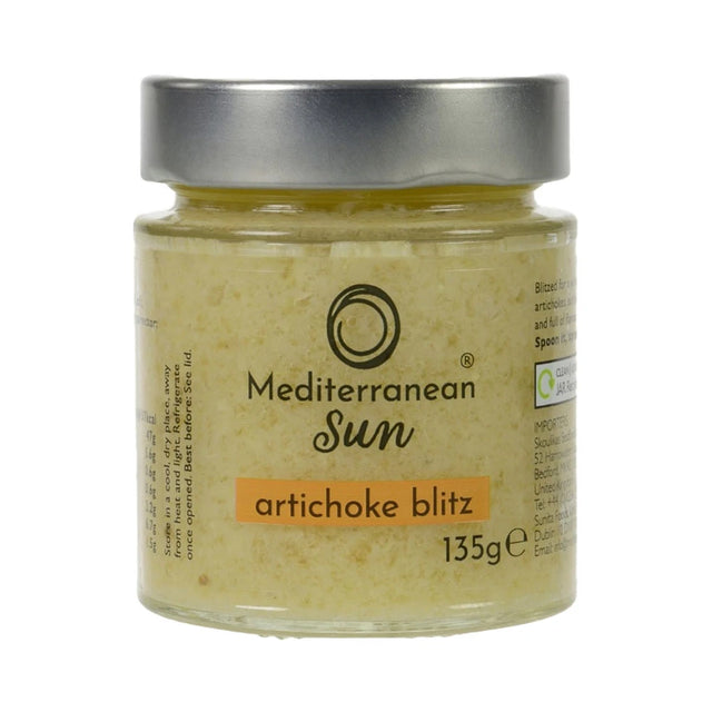 A glass jar with a metal lid labeled "Mediterranean Sun Artichoke Blitz, 135g". The jar contains a yellowish paste, suggesting a creamy artichoke spread.