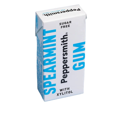 A Peppersmith Spearmint Gum carton, white with blue and black text, standing on a light blue background.