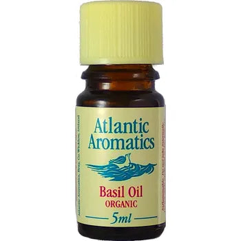 Atlantic Aromatics organic basil essential oil in a 5ml amber glass bottle with a yellow cap.