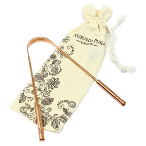 Ayurveda Pura London pure copper tongue scraper with decorative cotton storage pouch.