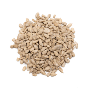 A pile of raw, shelled sunflower seeds isolated on a white background.
