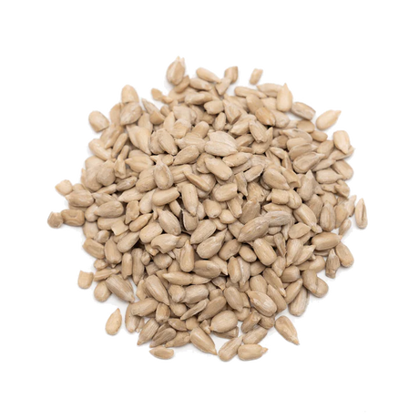 A pile of raw, shelled sunflower seeds isolated on a white background.