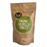 A 250g stand-up pouch of True Natural Products Organic Chlorella Tablets on a plain white background.