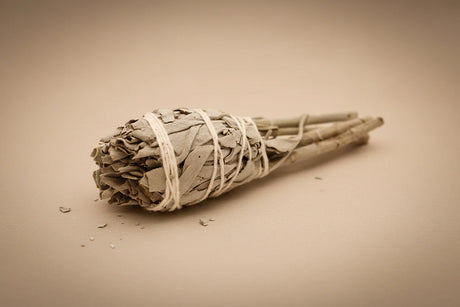 "Small artisan white sage smudge torch, hand-tied with natural twine for cleansing rituals."