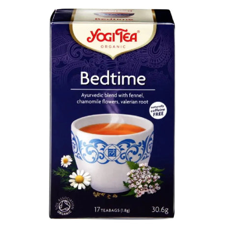 Yogi Tea Bedtime tea box with a cup of tea and tea leaves on a white background